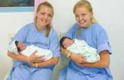 Gap Medics students in Thailand holding babies in the obstetrics and gynecology department