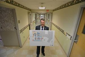 Mark Sparta, CEO of HackensackUMC at Pascack Valley, with the plans for the hospital’s new emergency department, which he called the “front door” of any hospital.
