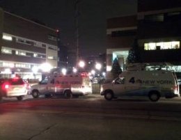 News vans gather outside Hackensack University Medical Center Monday night.
